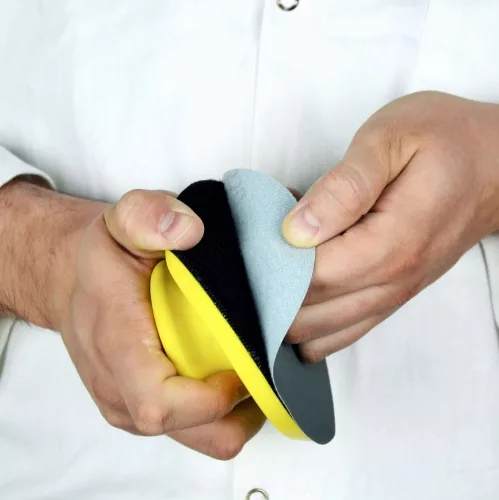 Hand sanding block in use, ergonomic sanding